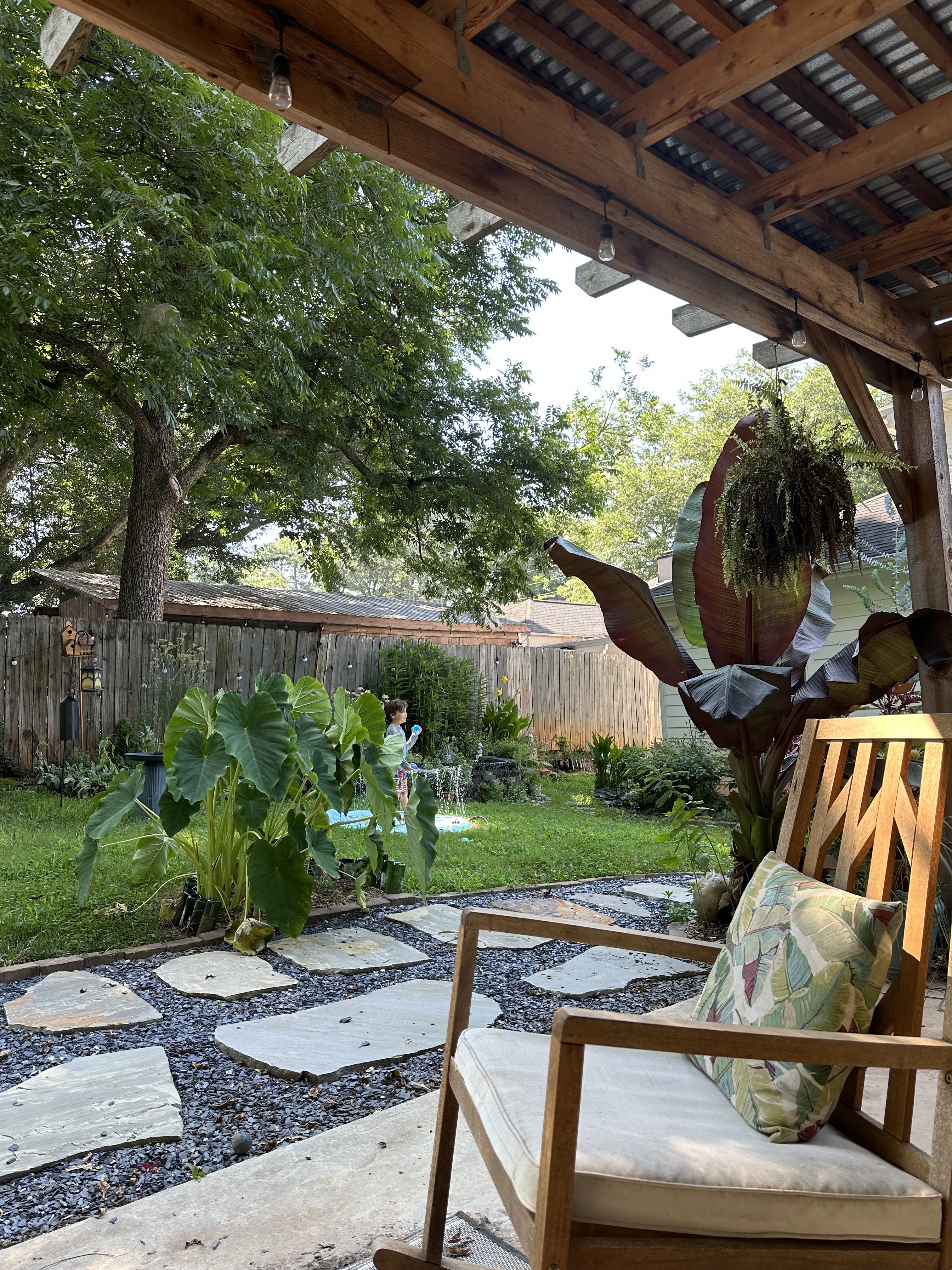 Back porch overlooking the lush garden